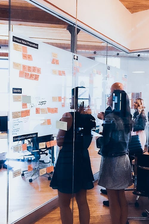 A whiteboard is placed inside our digital marketing agency boardroom. Our marketing experts are working on a brand identity